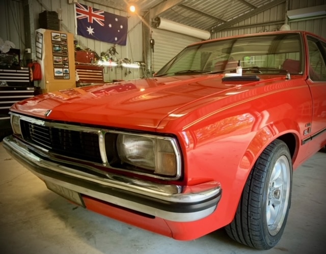 Shiny red Holden Torana front